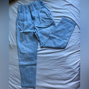 Very high waisted jeans with pleated waistband